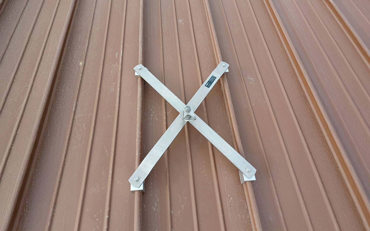 Standing seam metal roof with certified anchor points for fall protection