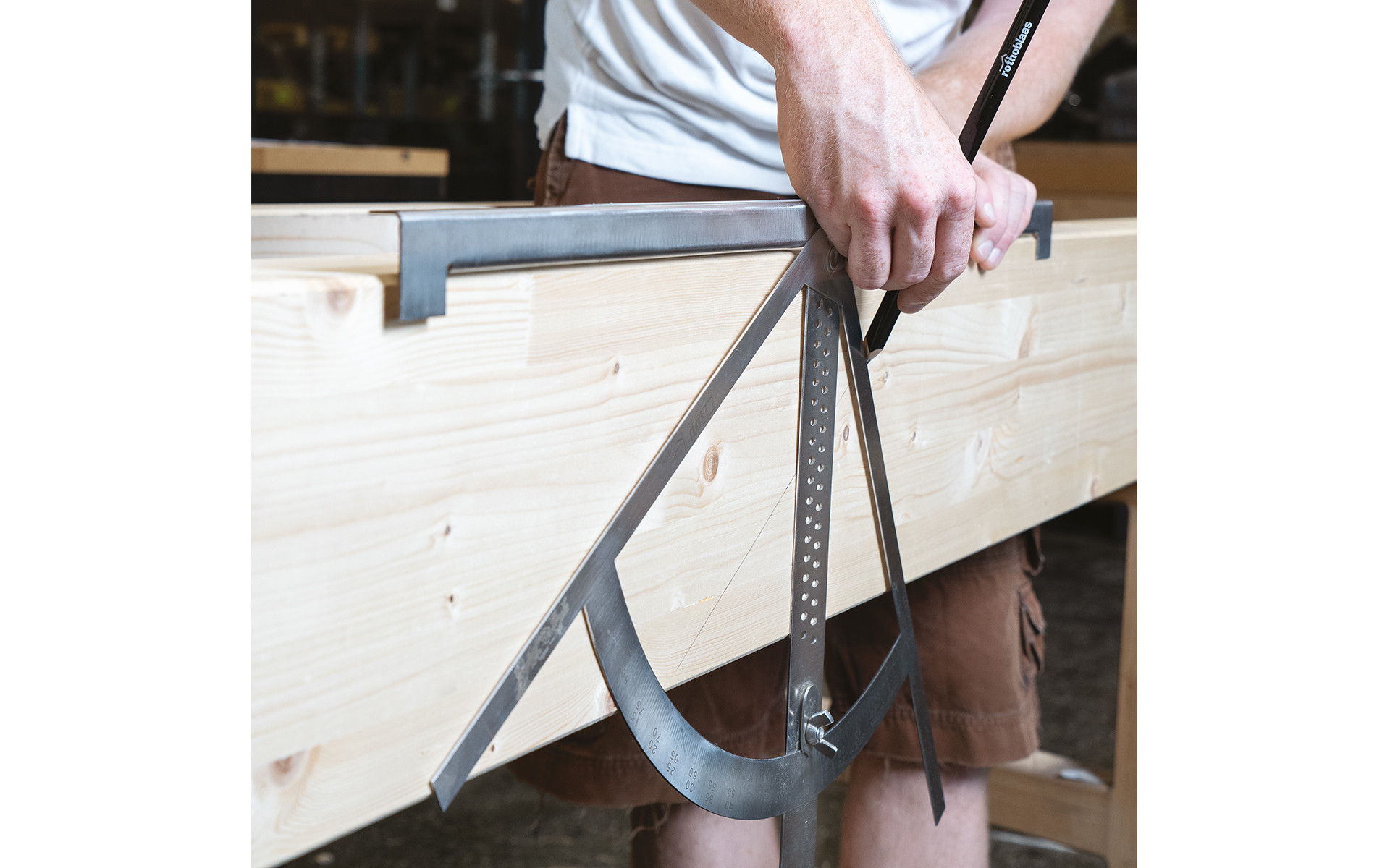 Carpenter’s square in use on timber surface 